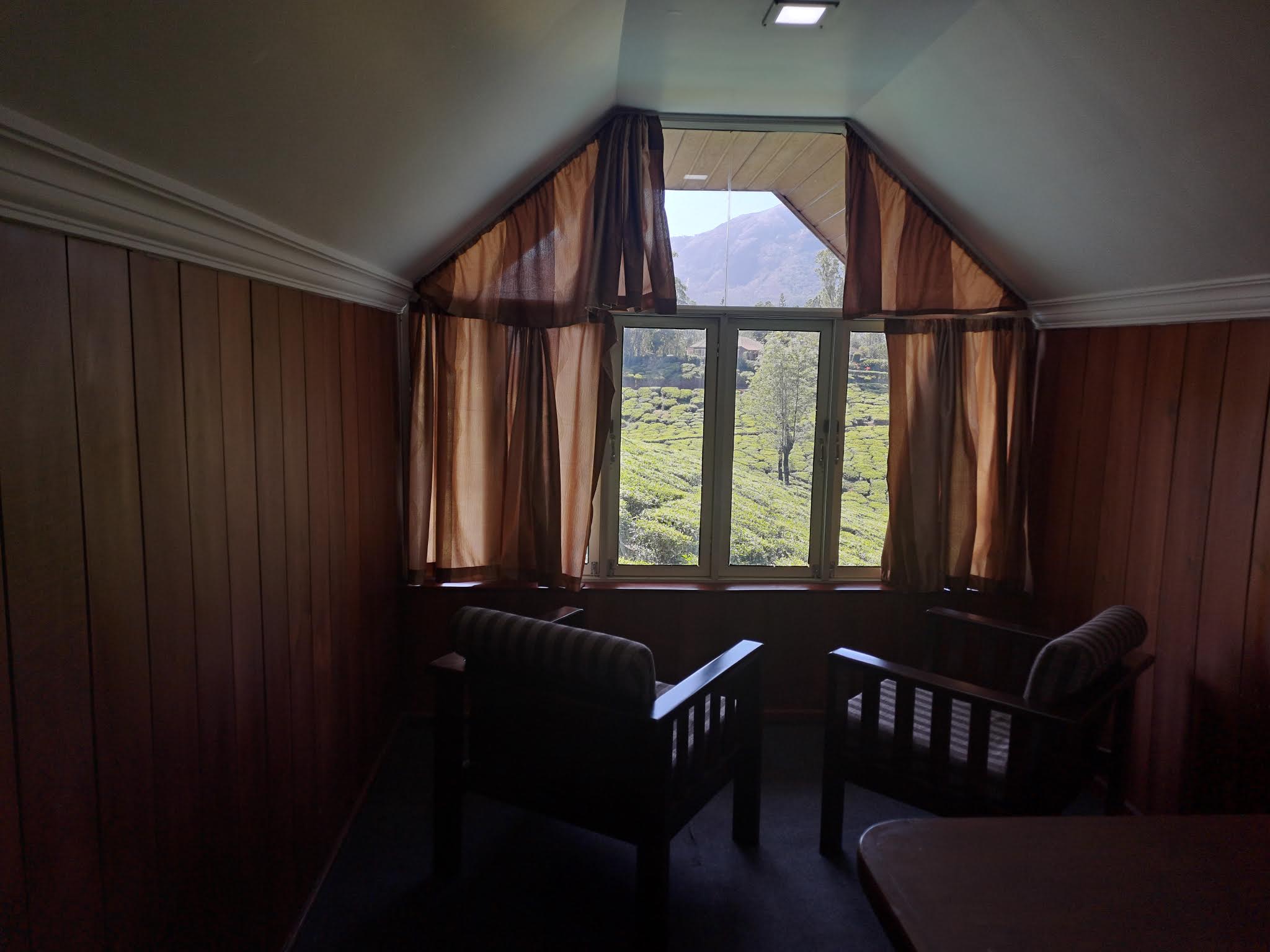 View looking out window into tea hills